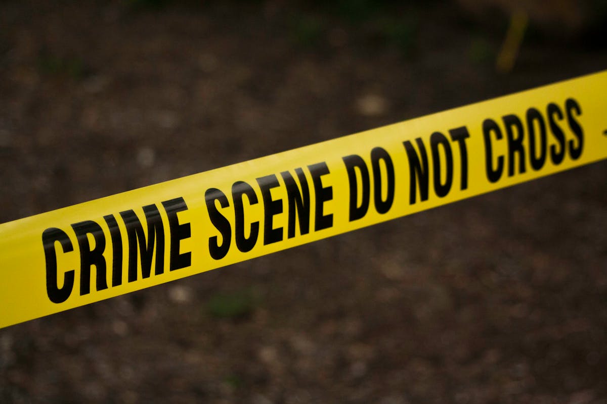 Police line crime scene tape at night